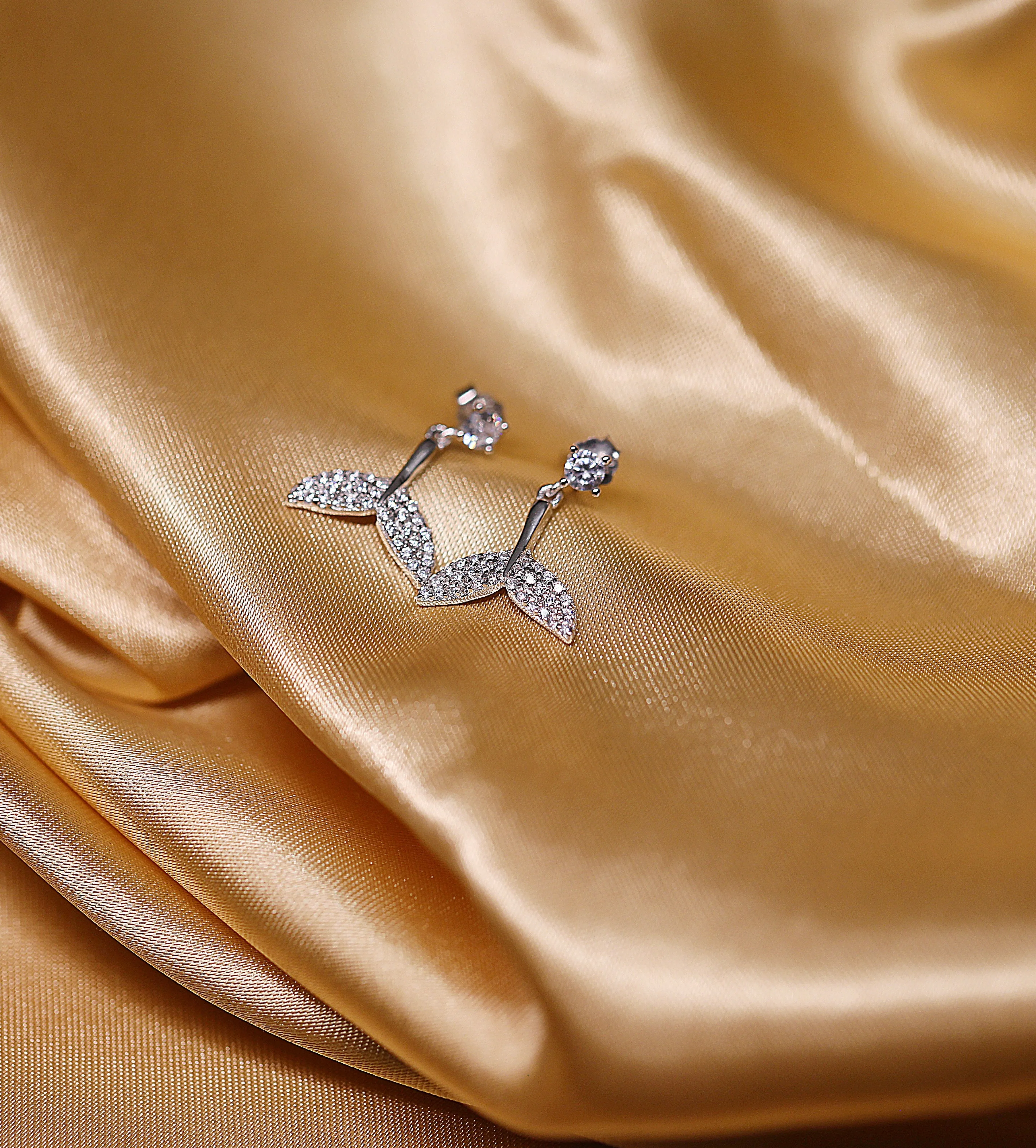 Dolphin tail drop earrings