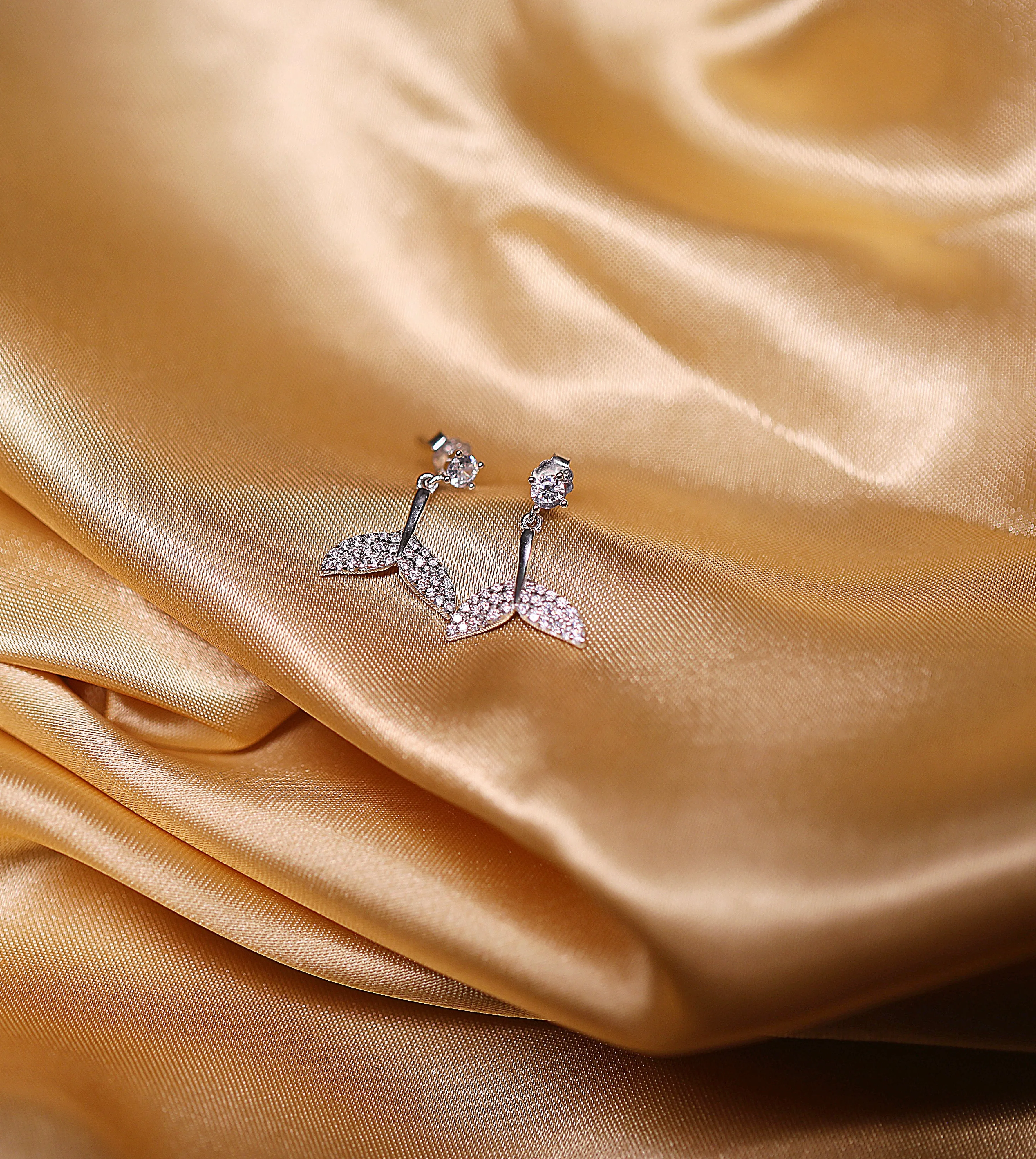 Dolphin tail drop earrings