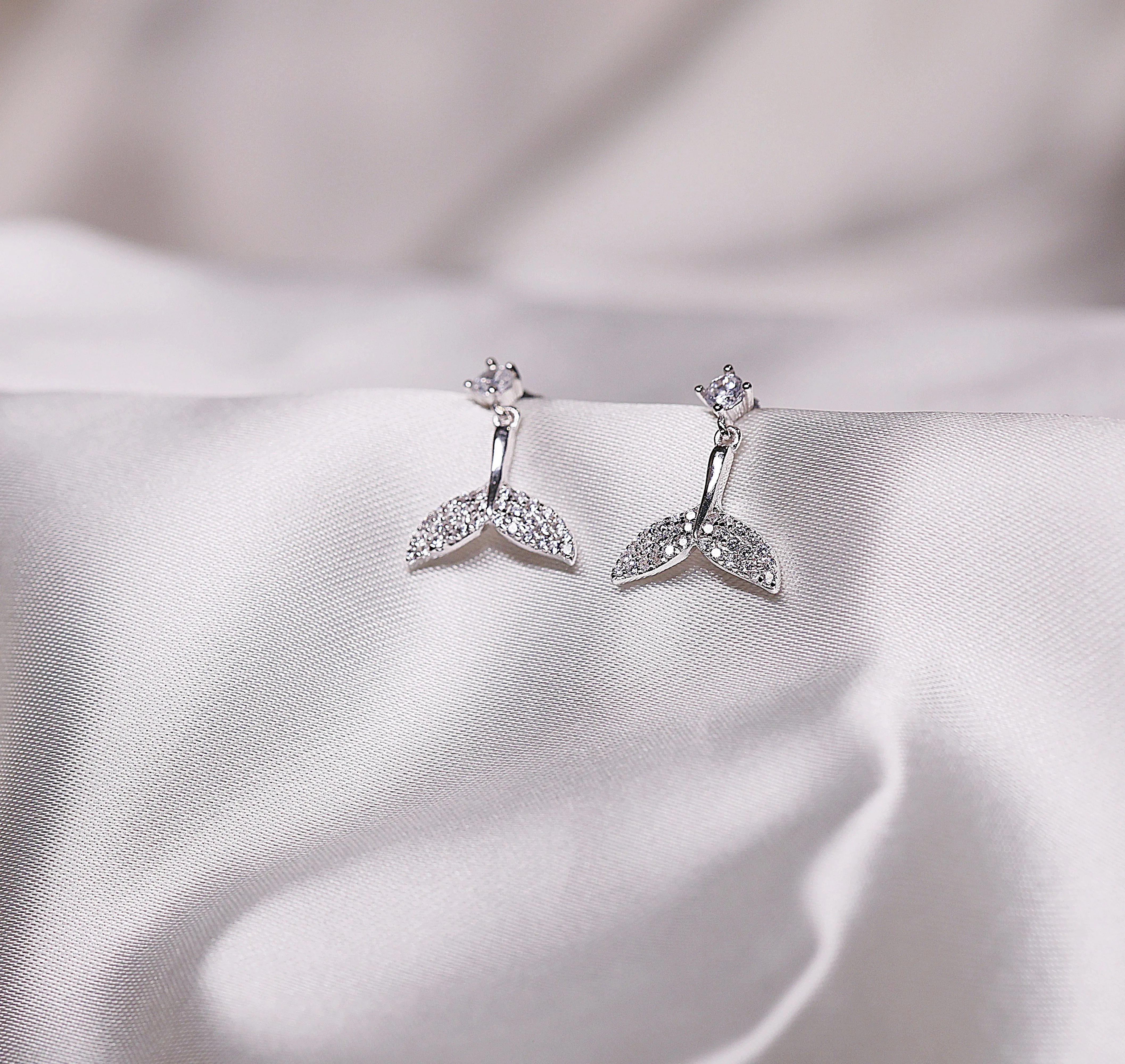 Dolphin tail drop earrings